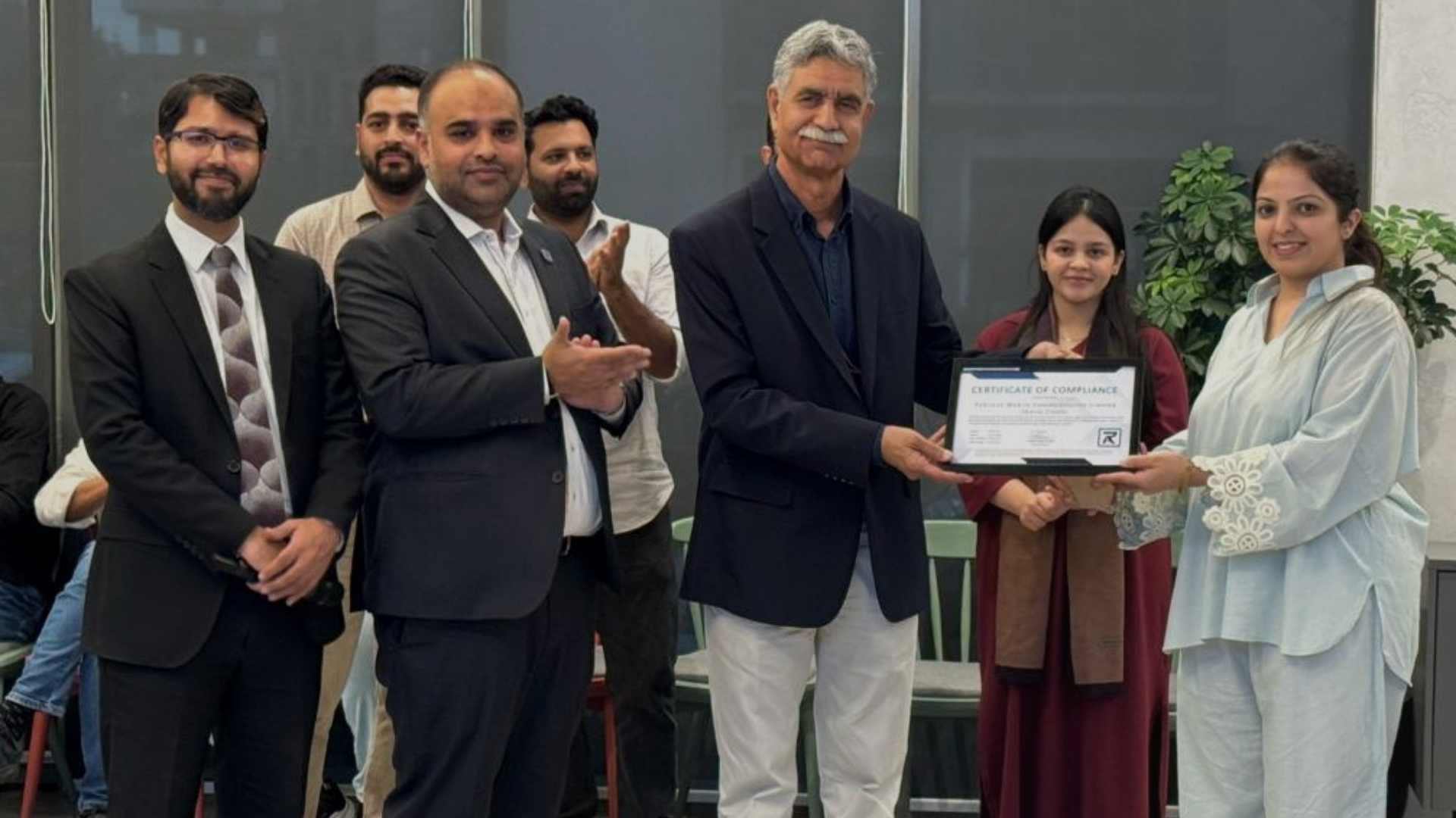 Dr Zahid awarding PCI DSS v4.0.1 certification to Jazz Garaj